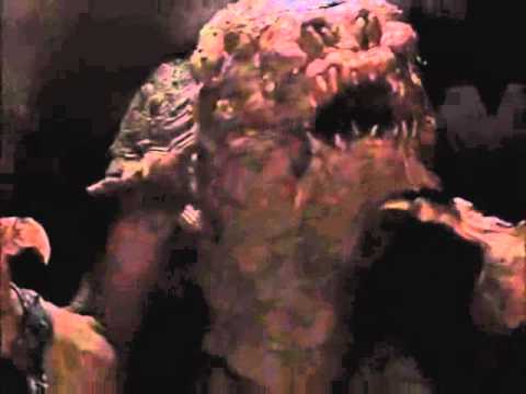 Rancor eats a Gamorrean guard