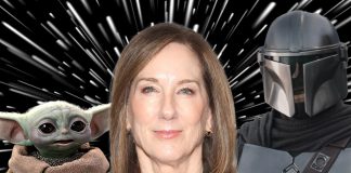 A cinematic shot featuring a Mandalorian, the small, green character Grogu, and Kathleen Kennedy.