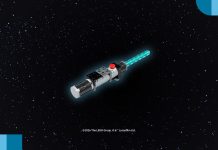 A brick-built LEGO Star Wars Lightsaber model with a glowing blue blade against a starry space background.