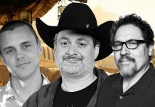 A black and white composite image featuring three men: Noah Kloor, Dave Filoni wearing his signature black cowboy hat, and Jon Favreau. They are positioned against a blurred, tan-colored Star Wars-themed background.