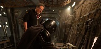 The Mandalorian and Grogu Movie News: New Stills and Empire Details Leaked Jon Favreau stands behind Din Djarin and Grogu on a practical set for the upcoming Star Wars movie.