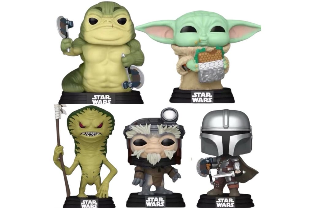 A collection of five leaked Star Wars Funko Pops for "The Mandalorian & Grogu," featuring a muscular green Hutt-like creature with axes, Grogu eating a snack, a tall slender green alien with a spear, an Anzellan character, and Din Djarin with a shield and vibroblade.