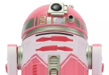 New QT-KT Droid Factory Figure Joins the 2026 Build-A-Droid Series Close-up front view of the QT-KT Droid Factory action figure, featuring a vibrant pink and white dome with silver metallic accents and a black primary photoreceptor lens.