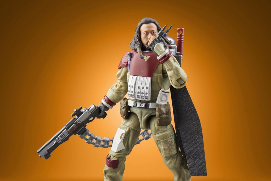 A detailed action figure of Baze Malbus from Star Wars Rogue One, part of The Vintage Collection, featuring his heavy repeating cannon and signature red and tan combat gear against an orange gradient background.