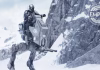 The Mandalorian (Din Djarin) piloting an Imperial AT-RT walker through a snowy, mountainous landscape in a still from The Mandalorian and Grogu movie.