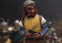 A high-detail sixth scale Sideshow Vizam figure wearing a yellow padded vest and holding a blaster pistol.