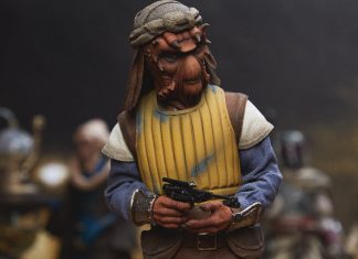 A high-detail sixth scale Sideshow Vizam figure wearing a yellow padded vest and holding a blaster pistol.