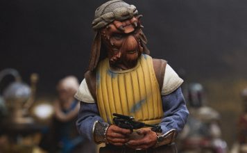 A high-detail sixth scale Sideshow Vizam figure wearing a yellow padded vest and holding a blaster pistol.