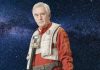Star Wars: Star Pilots – Wedge Antilles Returns in New Action-Packed Story This Fall A portrait of an older Wedge Antilles (Denis Lawson) in a red Resistance flight suit and white life vest against a star-filled space background.