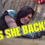 Gina Carano as Cara Dune in a tactical pose on the ground from The Mandalorian, with the text "IS SHE BACK?" overlaid in bold yellow letters.