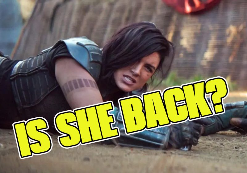 Gina Carano as Cara Dune in a tactical pose on the ground from The Mandalorian, with the text "IS SHE BACK?" overlaid in bold yellow letters.