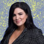 Gina Carano smiling in a black and white checkered blazer against a blue background with yellow splatters.