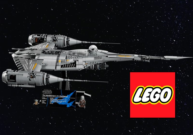 A side profile of the LEGO 75442 UCS Mandalorian N-1 Starfighter on a black display stand against a starfield background, featuring a printed information plaque and minifigures of Din Djarin and Grogu.