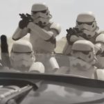 Four Imperial Stormtroopers in a dark speeder during a high-speed chase scene from the movie The Mandalorian and Grogu.