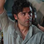 Oscar Isaac as Poe Dameron looking determined in a scene from the Star Wars sequel trilogy.