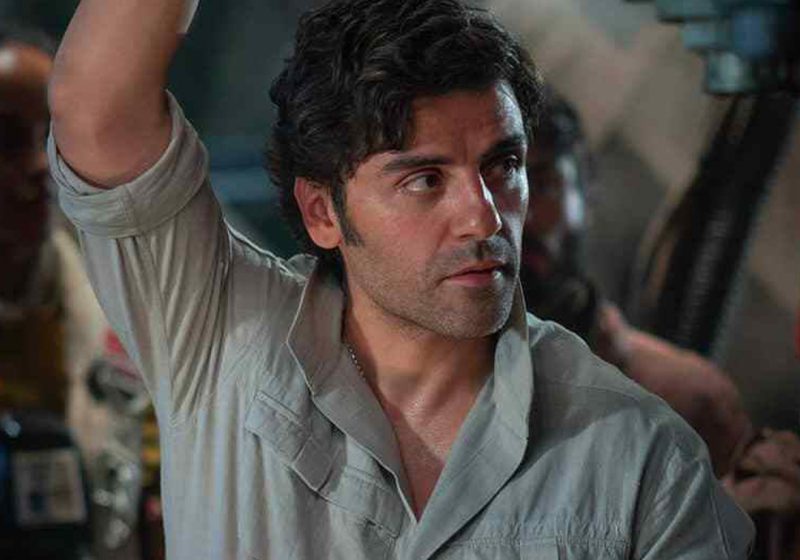 Oscar Isaac as Poe Dameron looking determined in a scene from the Star Wars sequel trilogy.
