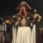 A highly detailed close-up of the Sideshow Tessek Sixth Scale Figure featuring his turquoise eyes, facial tentacles, and ornate bronze belt in a Jabba's Palace setting.
